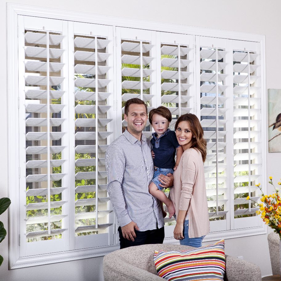 Family in front of Polywood shutters